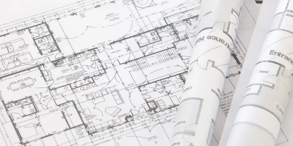 How much does an extension costs? It depends on the size, you'll need plans drawn up like those shown in the photo.