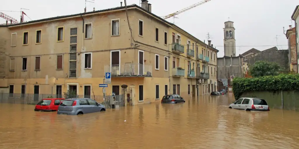 Should you buy a flood-risk property? This image shows a building partly underwater thanks to an extreme flood.