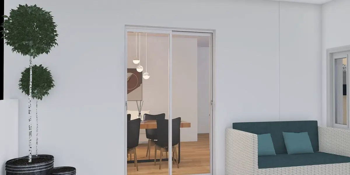 A sleek sliding door reveals a dining room with a wooden table and chairs, while a potted plant and wicker sofa with cushions adorn the terrace. This design is undeniably the better option for effortlessly merging indoor and outdoor spaces.